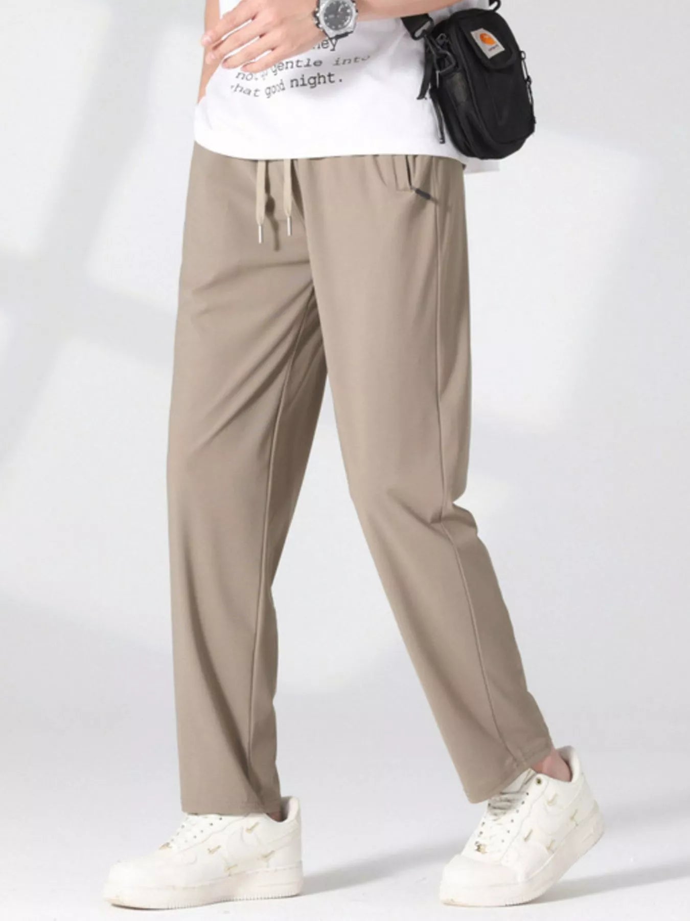 Plus size men's casual lightweight quick-dry pants by Trendsi, shown in a relaxed fit with a modern design, suitable for active wear.