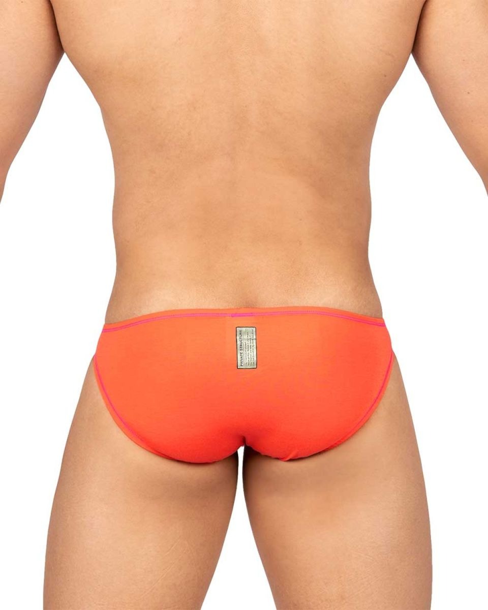 Private Structure Prime Eutopia Bikini Brief by CITYBOYZ★USA in tangarine color, shown on a model with a close-up view of the swimwear.