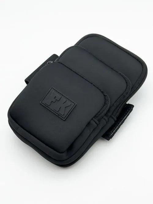 CITYBOYZ USA FK Sport Cross Body Bag with three pockets, neoprene material, and adjustable strap for versatile carrying.