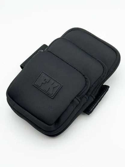 CITYBOYZ USA FK Sport Cross Body Bag with three pockets, neoprene material, and adjustable strap for versatile carrying.