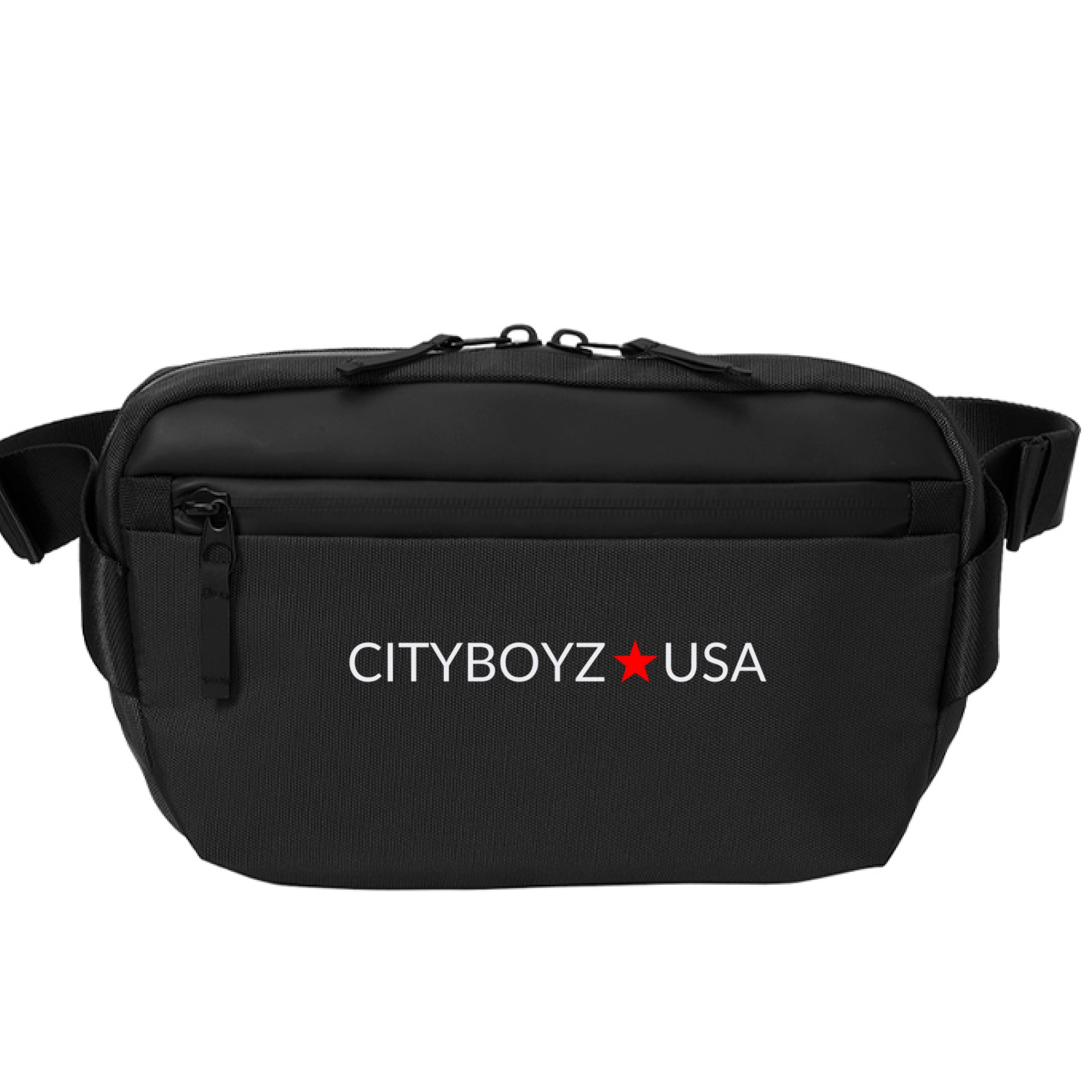 CITYBOYZ★USA Mercer Mettle Crossbody Pack in black with adjustable strap and multiple compartments, designed for convenient everyday use.