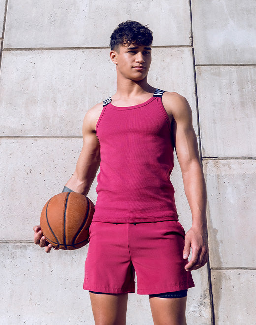 Red Supawear SPR Max Tank Top by CITYBOYZ★USA displayed on a hanger with a plain background.
