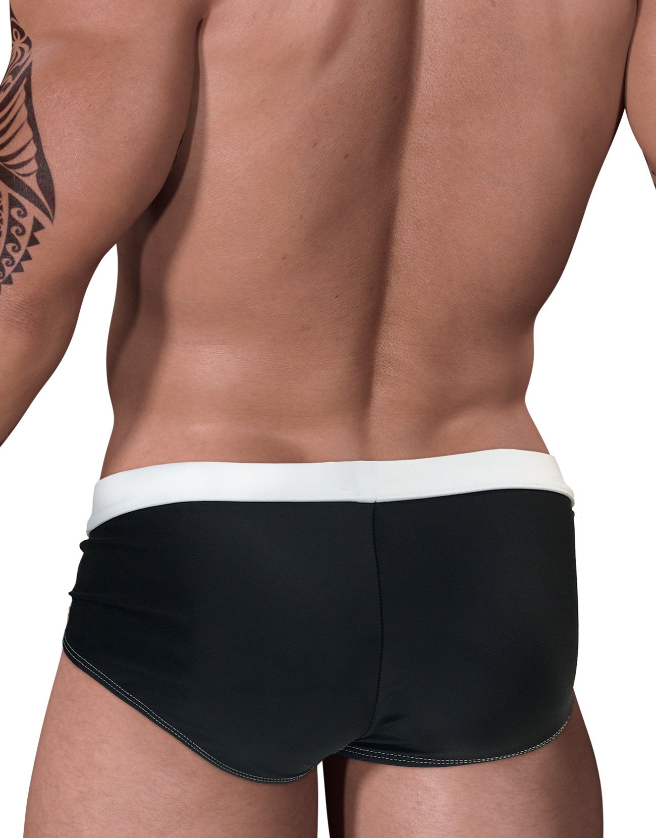 Black and white WildmanT Moby Big Boy pouch swimwear shown from the back, designed for comfortable boys' swimwear.