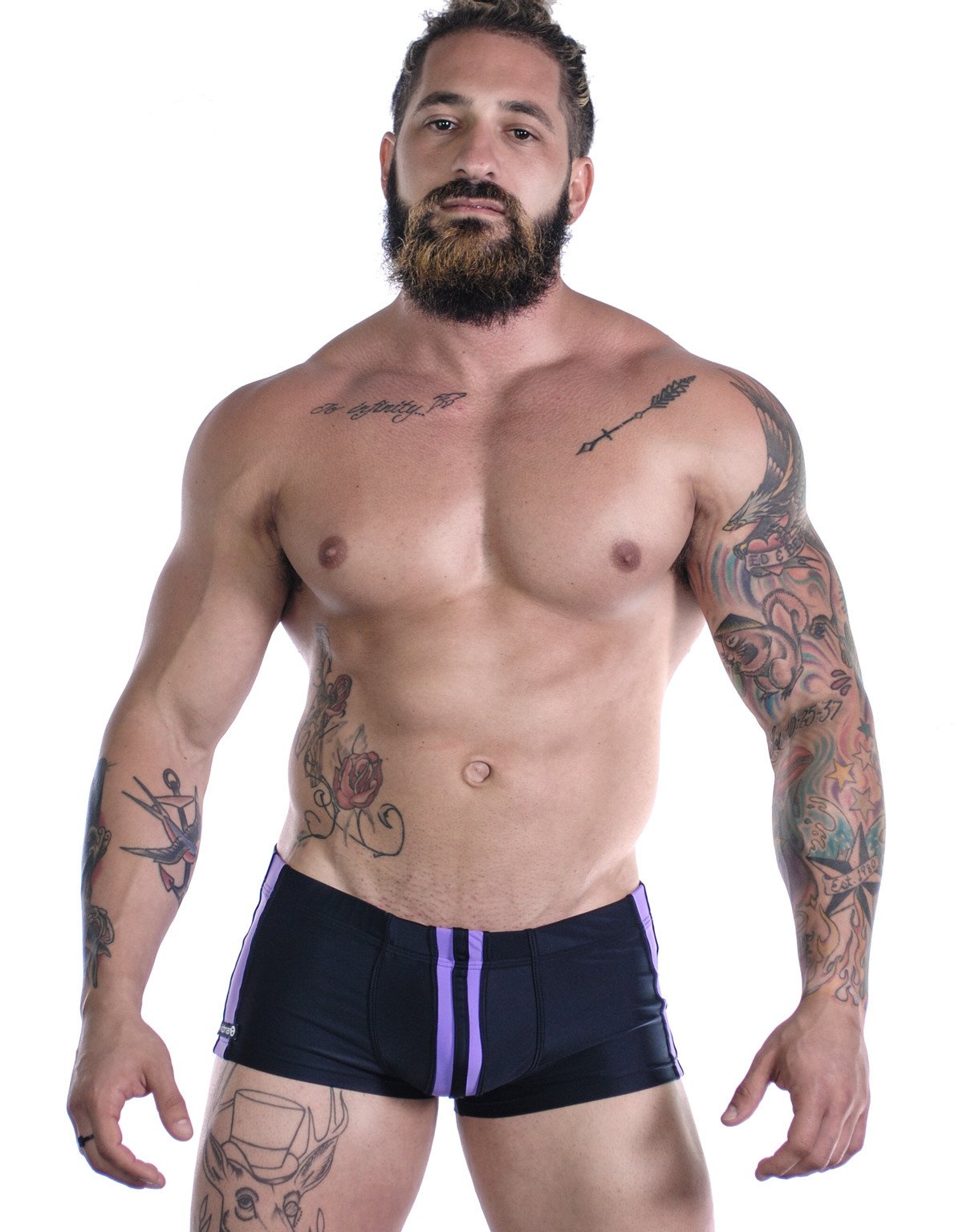 Wildmant Sportivo square cut swimwear in black and purple with bold design, featuring a sleek fit and vibrant color contrast.