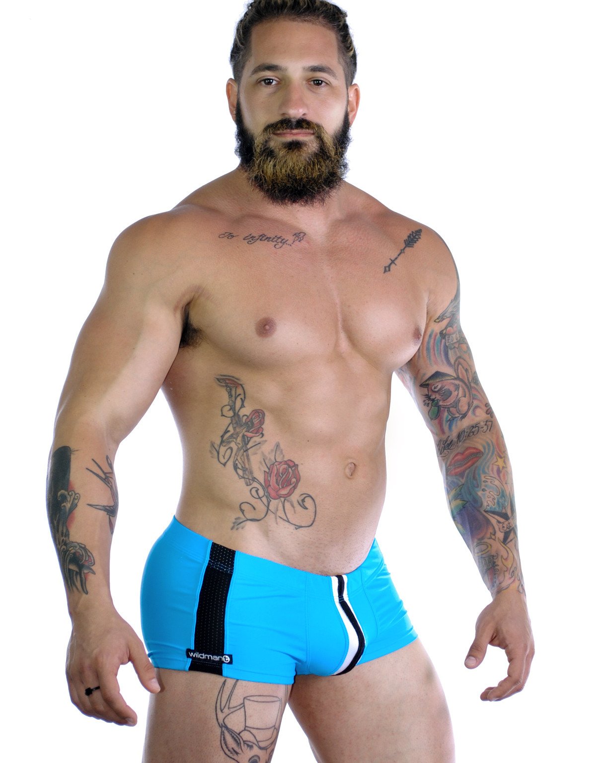WildmanT Wildmant Sportivo square cut teal swimwear shown from side view, highlighting the sleek design and vibrant color.